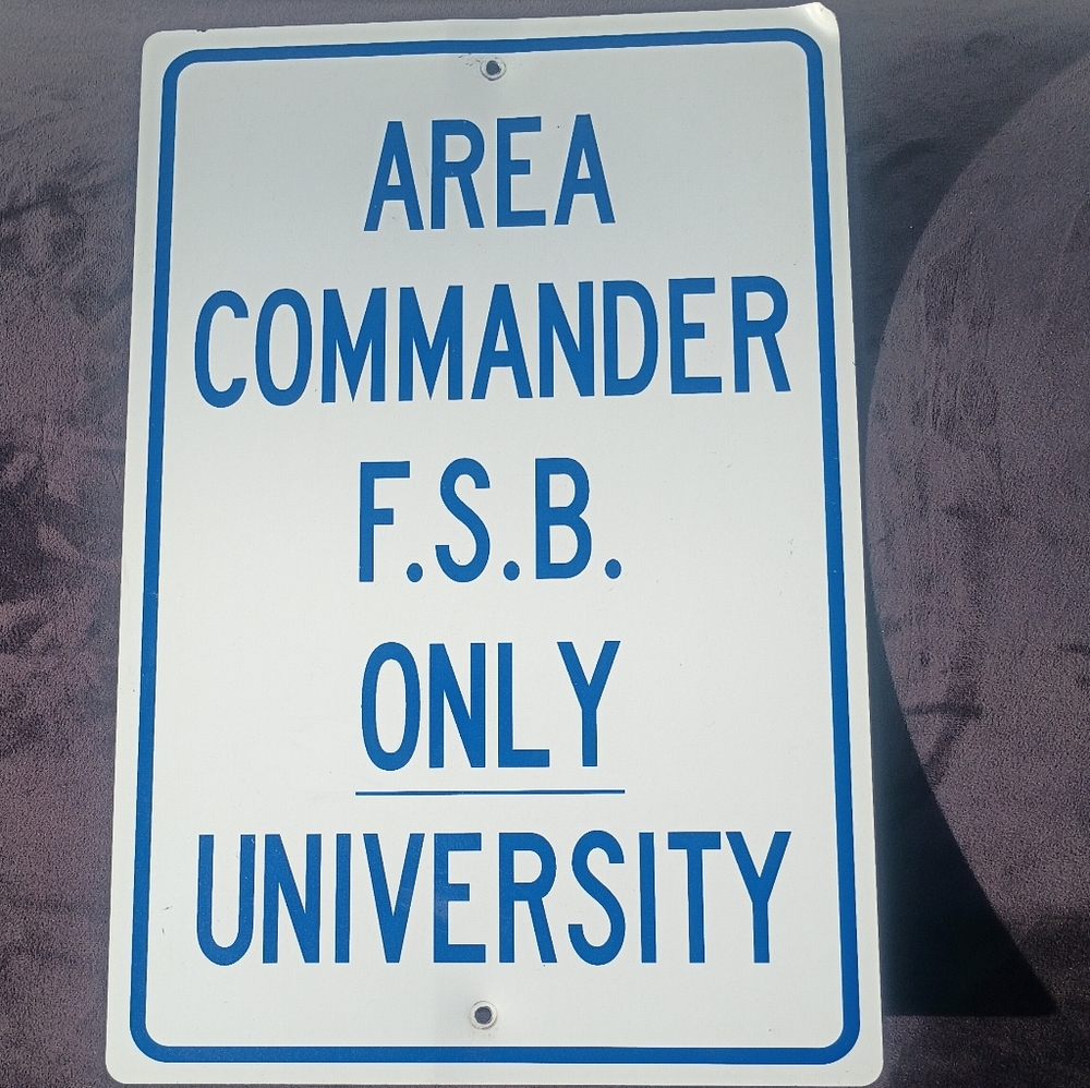 White and Blue Metal Sign - "AREA COMMANDER F.S.B. ONLY UNIVERSITY"